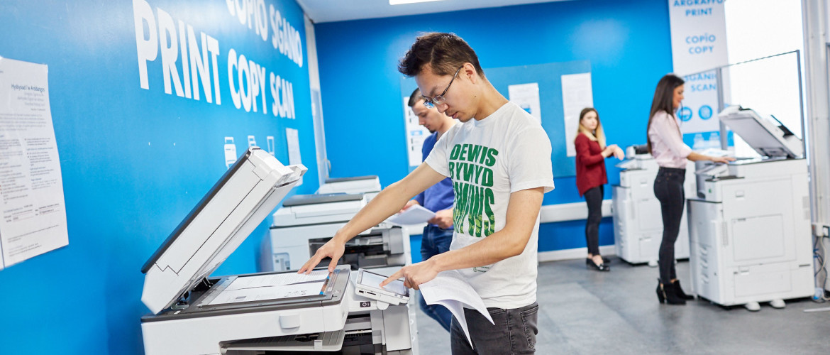 Person using a photocopier. 